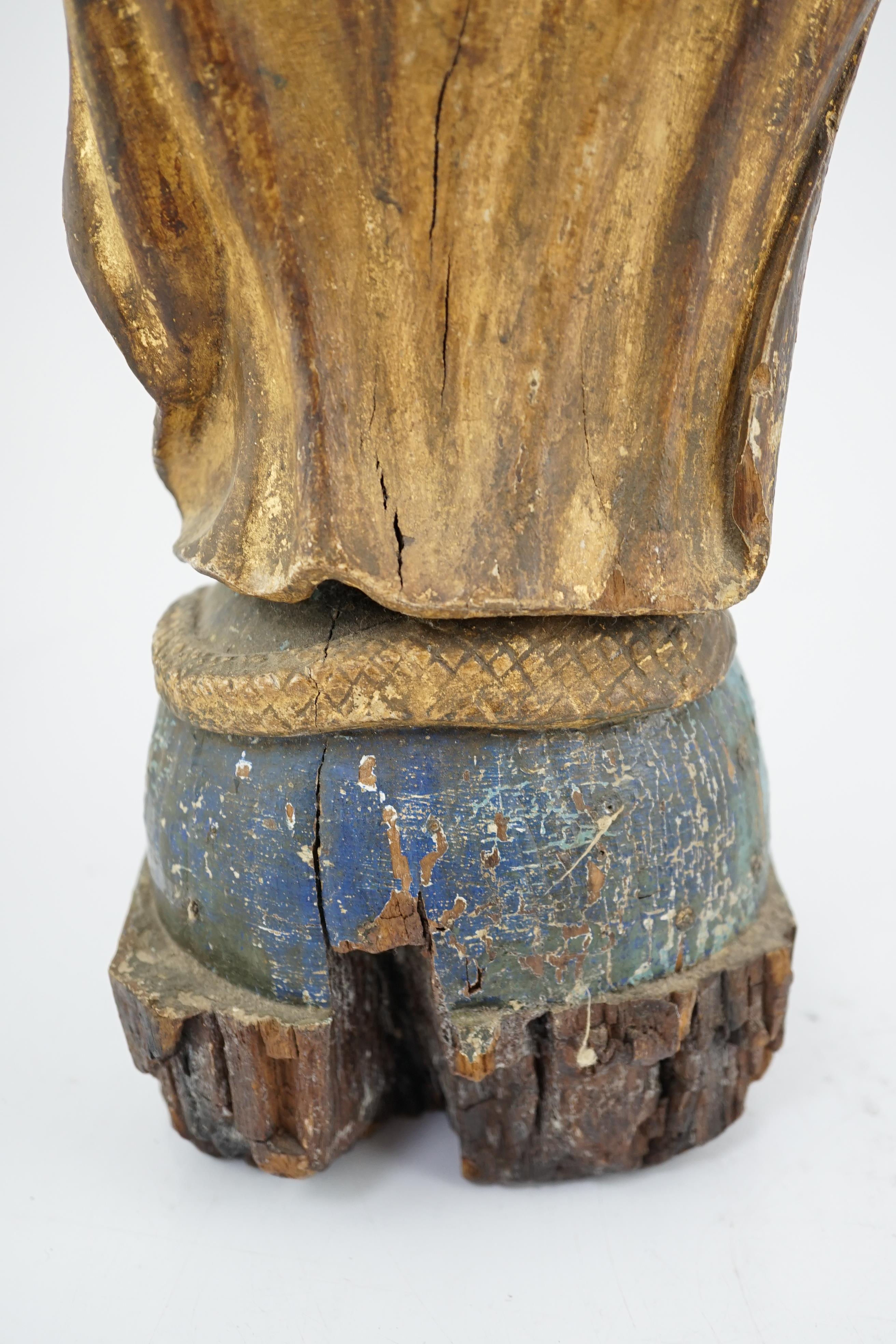 An 18th century Continental carved wood figure of a female saint